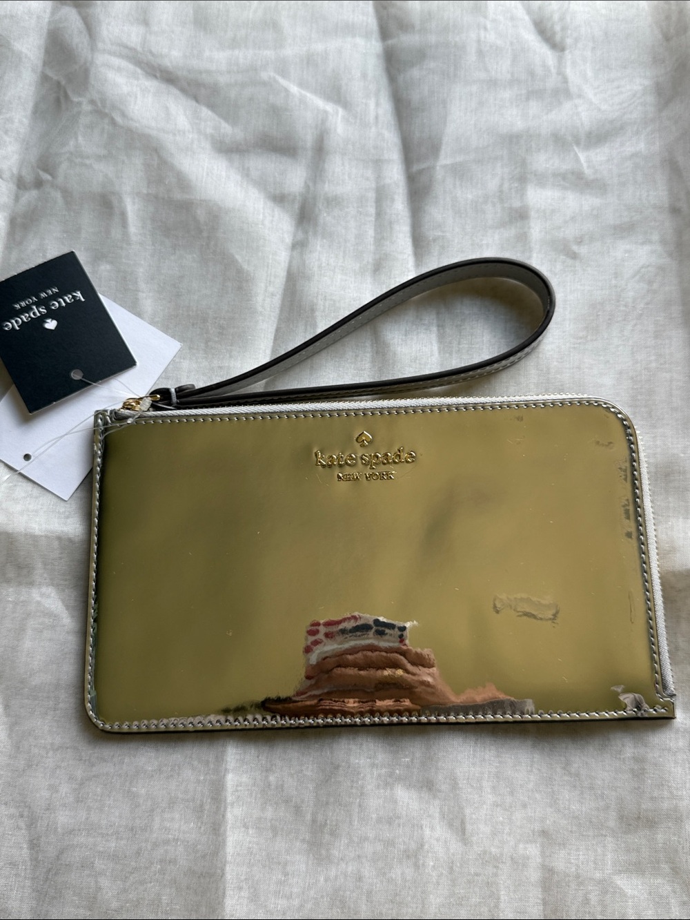 kate spade mirror metallic silver wristlet gold hardware